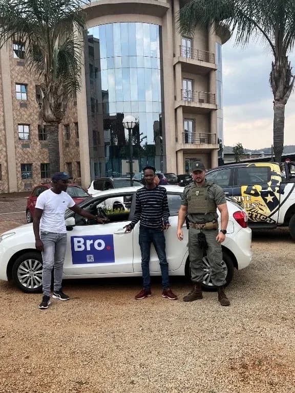 Bro team and security partner on site with a Bro-branded vehicle during a field operation