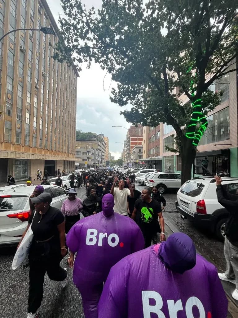 Community march against gender-based violence led by Bro mascots in Johannesburg